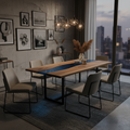 84-inch live-edge walnut river table with blue epoxy resin river as dining room centerpiece with modern chairs and pendant lights